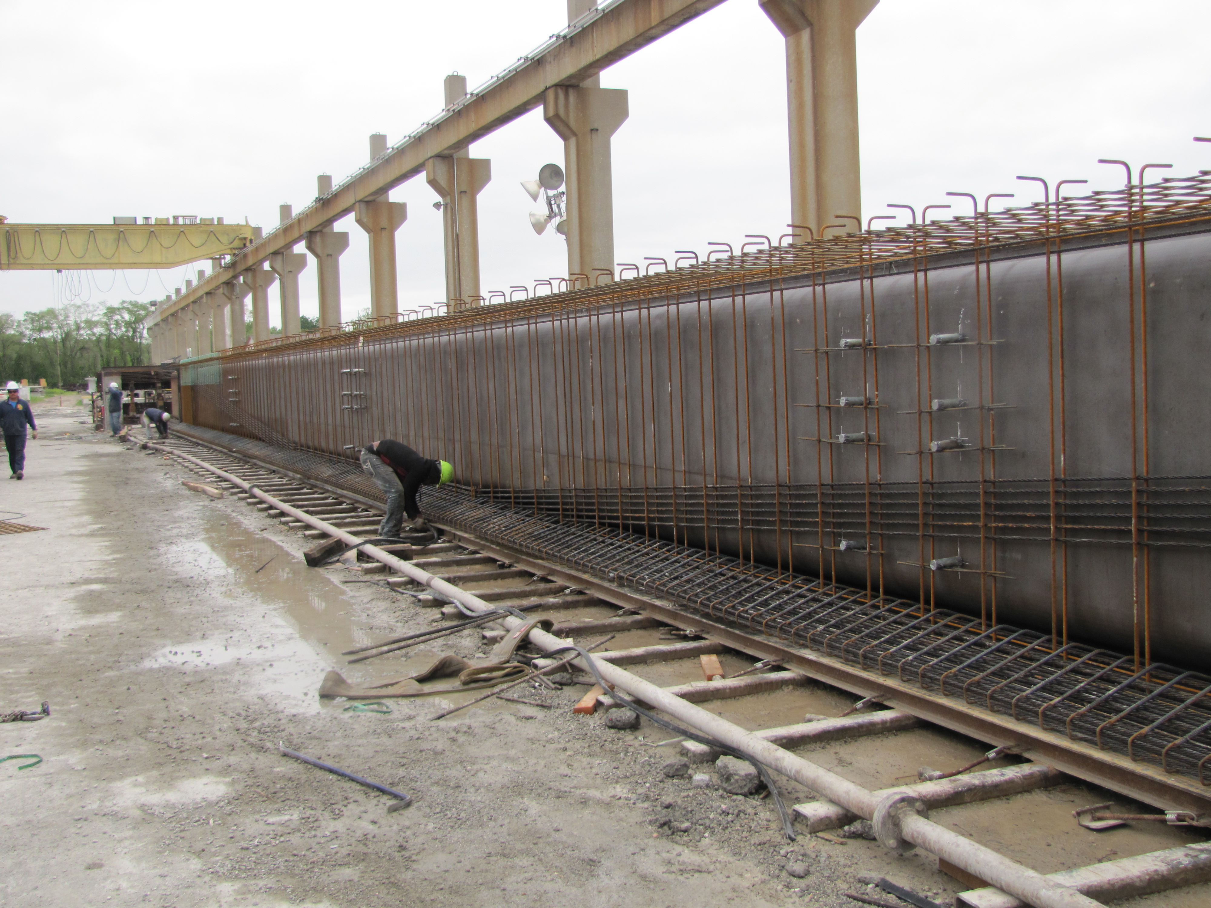 STRUCTURAL WWR PLACEMENT IN A HIGHWAY BRIDGE PRECAST GIRDER CASTING BED.  WWR UTILIZED IN TOP FLANGE, STEM, AND BOTTOM FLANGE FOR ALL MILD STEEL REINFORCEMENT APPLICATIONS.